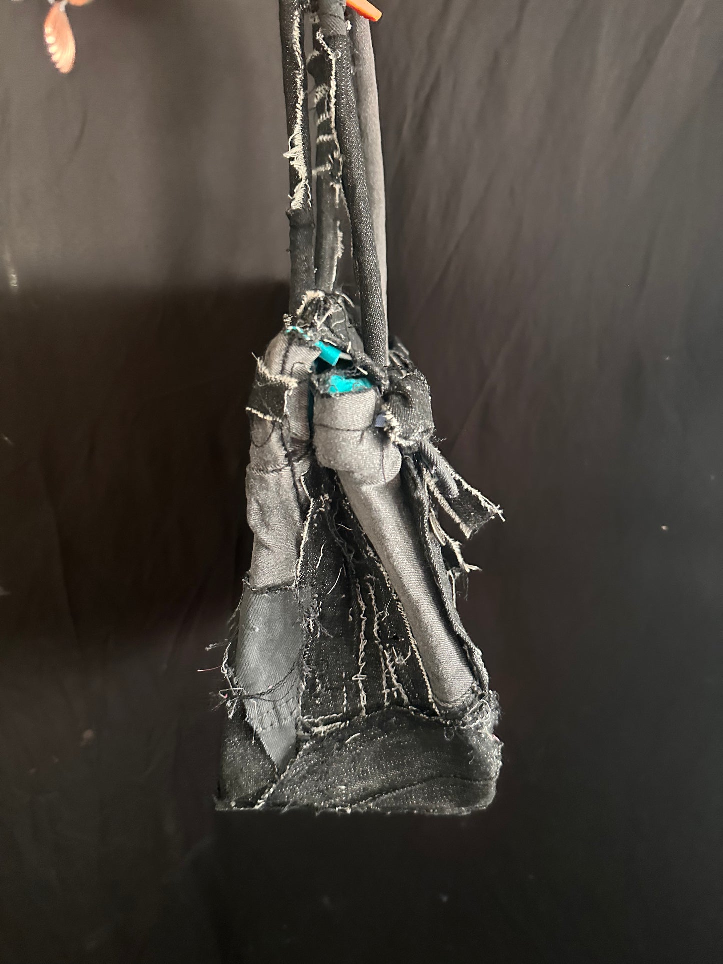 Distressed black denim bag