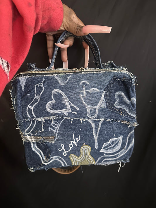 Denim clutch with brown strap