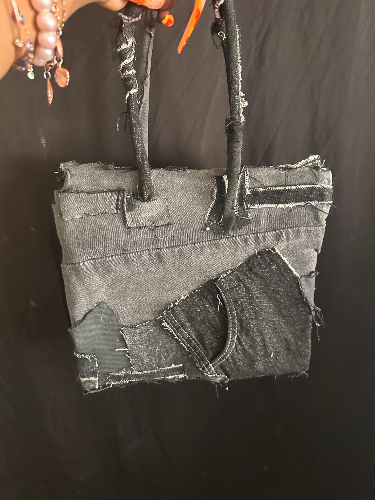 Distressed black denim bag